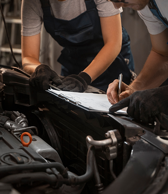 ASE-certified mechanics performing scheduled multi-point inspection
